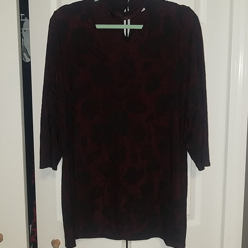 Burgundy w/black leaf like flowers